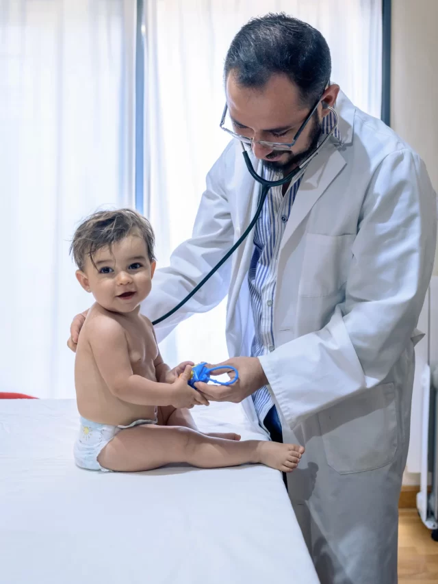 doctor-observing-one-year-old-baby